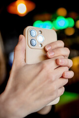 The girl takes pictures on the phone