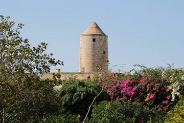 Tower of an old windmill viewed from the Garden of the Palazzo Parisio in Naxxar, Malta