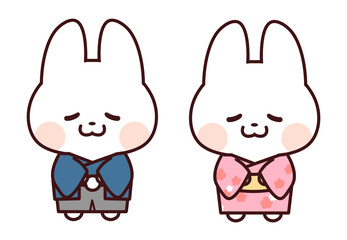 青とピンクの着物を着てお辞儀するうさぎ/白