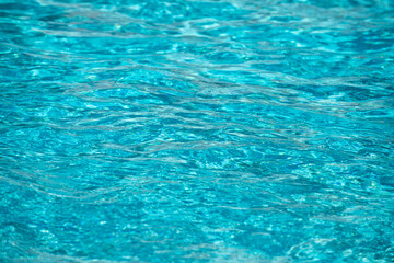Tansparent clear calm water surface texture. Abstract nature background. Sea water pattern.