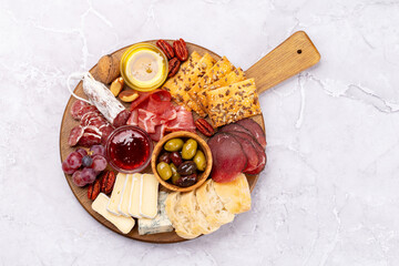 Antipasto board with prosciutto, salami, crackers, cheese