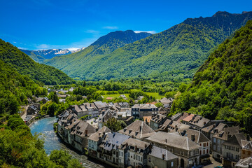 View on the small town of Saint Beat Lez and the Garonne river in the South of France - obrazy, fototapety, plakaty