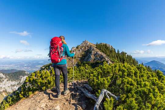 Germany, Bavaria, Female hiker on summit of Wildalpjoch mountain