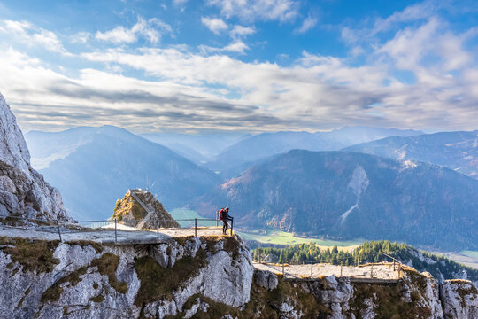 Germany, Bavaria, Female hiker admiring landscape of Bavarian Alps from observation point