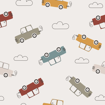 Cartoon cars bohemian style. Seamless pattern with transport. Simple background for the design of a children room, textiles. Cute toy vehicle. Doodle machine design in pastel retro tones. 