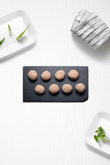 Meatballs on a kitchen with some herbs