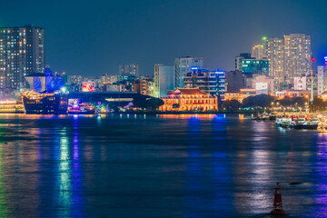 Fototapeta na wymiar Ho Chi Minh City, Vietnam - December 26, 2022: Beautiful night in Ho Chi Minh city known as Saigon, one of the big cities is developed in Vietnam. See Bitexco tower, saigon river and center city view 
