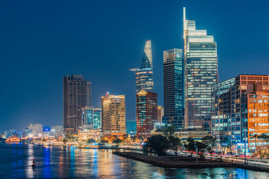 Ho Chi Minh City, Vietnam - December 26, 2022: Beautiful night in Ho Chi Minh city known as Saigon, one of the big cities is developed in Vietnam. See Bitexco tower, saigon river and center city view 