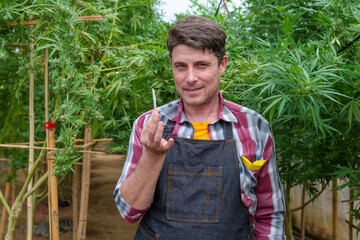 Young person smoking marijuana joint - Cannabis, stoner and weed concept - Main focus on face