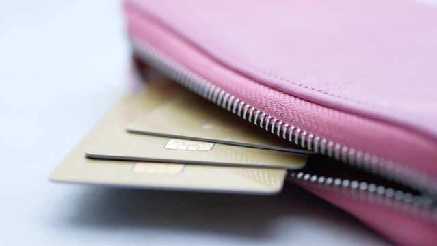 close up of credit cards in a wallet on white background 