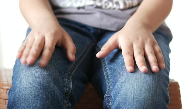 close up of a nervous child hand 