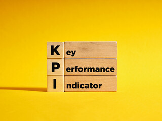 Wooden cubes with the the abbreviation KPI key performance indicator. Business concept.