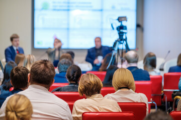 Crowd during business seminar in auditorium