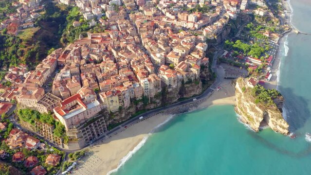 4k drone flying over footage (Ultra High Definition) Tropea cityscape, Italy, Europe. Colorful summer scene of east coast of Calabria. Stunning seascape of Mediterranean sea.