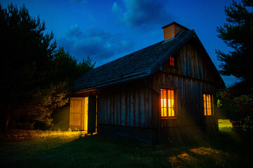 Wooden house at night.
