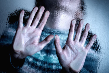 Dramatic portrait of young child girl showing STOP gesture