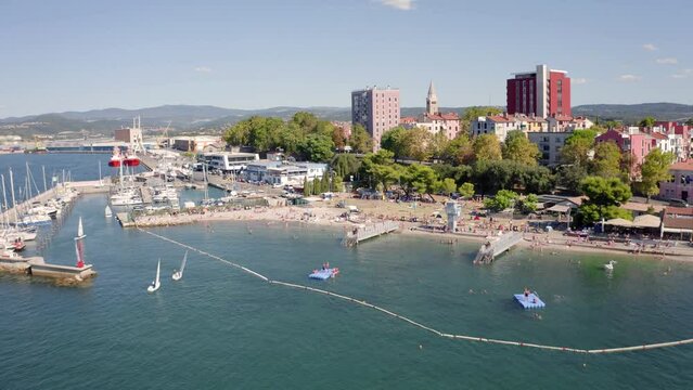 4k drone forward video (Ultra High Definition) of Koper port. Colorful summer scene of Adriatic coastline, Slovenia, Europe. Picturesque Mediterranean seascape. Traveling concept background.