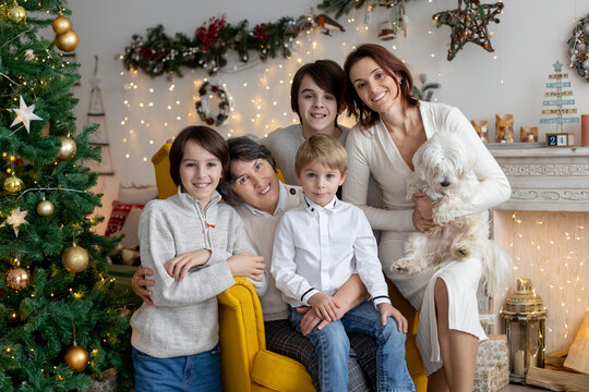 Christmas family picture in cozy home with lights and decoration