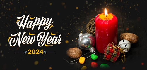 Happy New Year 2024 theme with Red candle and christmas theme on dark table