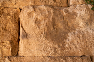 Remains of an ancient handcrafted wall. grunge texture. abstract background.