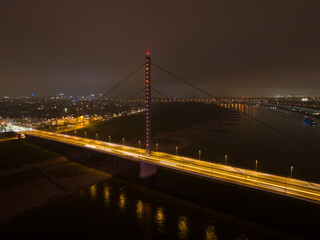 Dusseldorf skyline city overhead view, river rhine, Rheinknie bridge, Rheinturm observation tourist attraction and broadcasting tower. Aerial drone view.