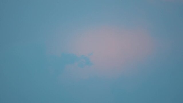 Time lapse of a beautiful pink colorful sky, sufring sunset clouds, 4K video