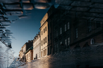 Kraków Market Square shot in water reflection in brick, Poland