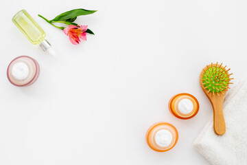 Hair care cosmetic products with brush, top view