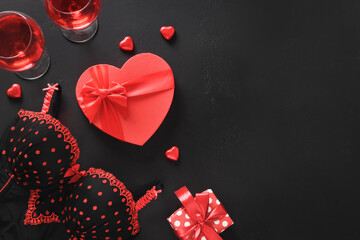 Romantic dating,Valentine's day, red gift, bustier underwear, wine and chocolate sweets. View from above. Copy space.