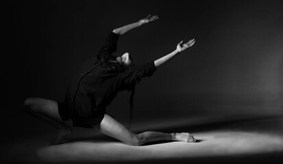 Female dancer isolated dancing with grey background