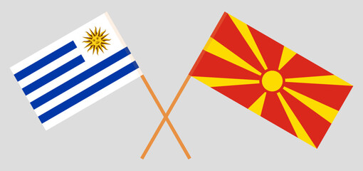 Crossed flags of Uruguay and North Macedonia. Official colors. Correct proportion