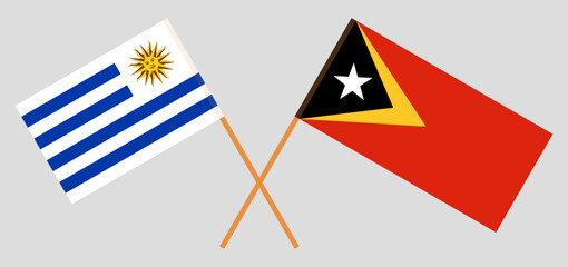 Crossed flags of Uruguay and East Timor. Official colors. Correct proportion