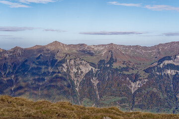 Scenic view from top of Axalp over Bernese Oberland with beautiful mountain panorama of the Swiss Alps on a sunny autumn day. Photo taken October 18th, 2022, Axalp, Switzerland.