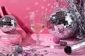 Glass of champagne with silver disco ball