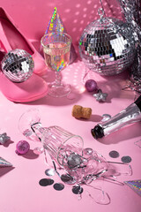 Glass of champagne with silver disco ball