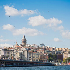Fototapeta premium View of the famous fourteenth-century Galata Tower and Galata Bridge from the Bosphorus Strait - Istanbul - Turkey