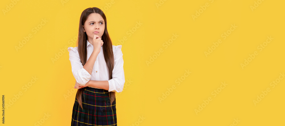 Canvas Prints pondering child in school uniform full length on yellow background, ponder. child face, horizontal p