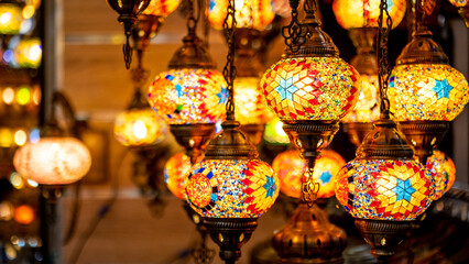 Lighting products sold in Istanbul Grand Bazaar, traditional Turkish lamps, touristic gifts, blurred background with spaces and text space		