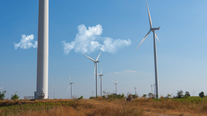 wind turbine in the sky. wind turbine in a field. wind turbine in the wind.