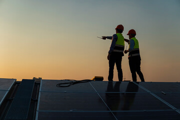 silhouette of a person with a solar panel. Photovoltaic Technology, Service Engineers inspecting...