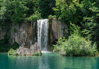 Fototapeta na wymiar Plitvice Lakes in Croatia. Sightseeing place. Very popular among tourists. Beautiful Landscape and Nature. Summer view of beautiful waterfalls in Plitvice Lakes National Park