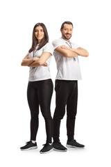 Full length portrait of a male and female sport coaches posing