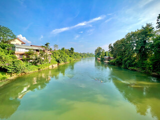 river scene with boats in Vang Vieng, Laos