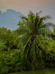 Fototapeta na wymiar hot air ballon over the mountains of Vang Vieng, Laos