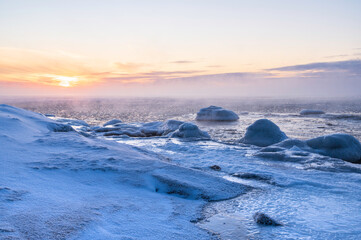 View of the frozen beach and sunset over the sea. Pörkenäs, Jakobstad/Pietarsaari. Finland © Sofie K
