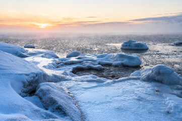 View of the frozen sea and setting sun. Pörkenäs, Jakobstad/Pietarsaari. Finland