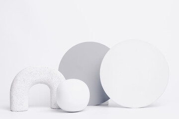 Abstract background with various geometrical forms and podiums in white color for product presentation. Podium to show cosmetic products.