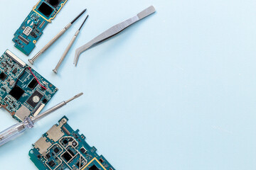 Tech support or repair servise concept. Circuit board with equipment and tools