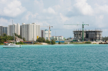 Panoramic view of large tropical island city apartments under construction