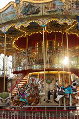 Fototapeta na wymiar The carousel is a timeless symbol of childhood wonder and magic, as the horses and animals spin round and round, the laughter of children fills the air, reminding us of the joys of youth.